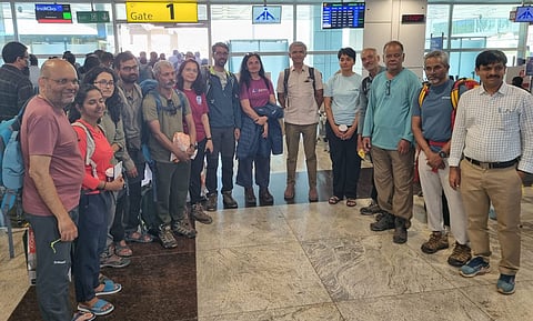 Krishna Byre Gowda with the 13 survivors.