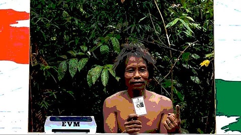 A member of Shompen tribe displaying ID card after voting in the recent general elections
