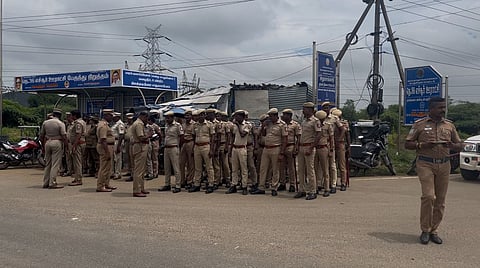 Police personnel awaiting striking workers