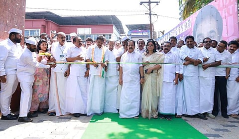 The image features congress leaders including K C Venugopal, V D Satheesan, Ramesh Chennithala and other congress leaders in white attire, inaugurating the Kozhikode DCC office.