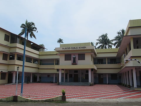 A front view of the main building of St Ritas school.