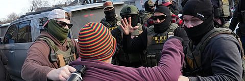 Protesters confront federal agents near the scene where Renee Good was fatally shot by an ICE officer in Minneapolis.