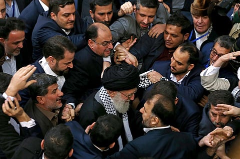 Iran's supreme leader Ayatollah Ali Khamenei, center, leaves an event titled "International Conference in Support of Palestinian Intifada," in Tehran, Iran, Feb. 21, 2017.