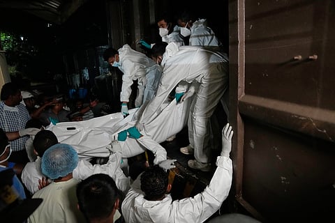 Healthcare workers unload the bodies of Iranian sailors from a vehicle who died when their IRIS Dena warship sank outside Sri Lanka's territorial waters, in Galle, Sri Lanka, Wednesday, March 4, 2026.