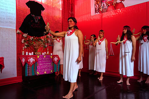 Demonstrators perform representing the female victims of a forced sterilization program under the administration of late Peruvian President Alberto Fujimori in Lima, Peru, Friday, March 6, 2026.