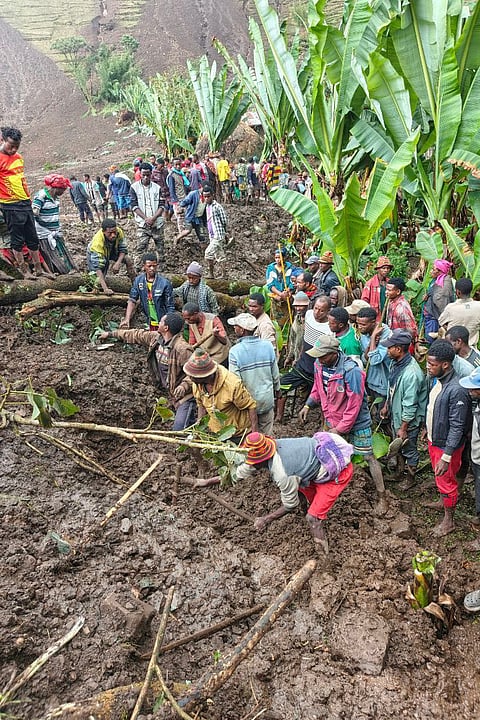 Locals search for the bodies of mudslide victims in the Gacho Baba district of the Gamo Zone in southern Ethiopia on Tuesday, March 10, 2026.