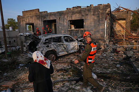 Trump says US bombed military sites on an island vital to Iran's oil network