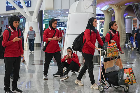 Members of Iran's women's football team arrive at the Kuala Lumpur International Airport in Sepang, Malaysia, Monday, March 16, 2026.