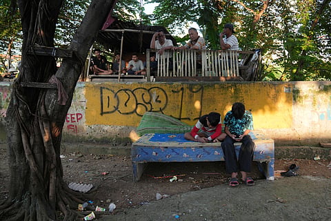 Teenage boys use their mobile phone in Jakarta, Indonesia, March 16, 2026.