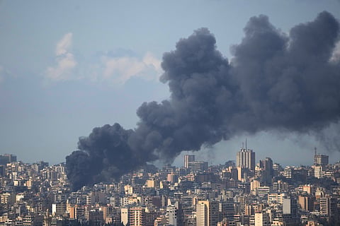 Smoke rises following an Israeli airstrike on a building in Beirut, Lebanon, Wednesday, April 8, 2026. (AP Photo/Hassan Ammar)