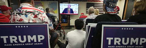 Phoenix residents watch presidential candidate Donald Trump speak at the Republican National Convention on July 18, 2024.