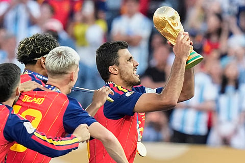 Spain's Ferran Torres (7) celebrates after scoring the opening goal of his team during the World Cup final soccer match between Spain and Argentina in East Rutherford, N.J., near New York.