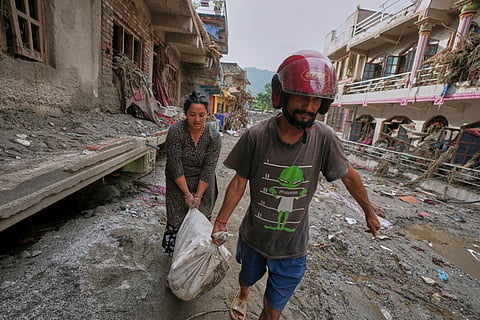 Rescuers search for thousands missing after floods at Nepal-China border