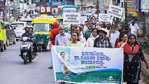 Environmentalists and others take out a rally demanding dropping the proposed Eco Park project in the area and call for greater protection of Madayippara