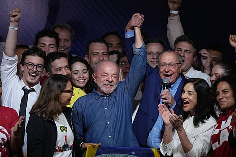President Luiz Inacio Lula da Silva celebrates with his running mate Geraldo Alckmin after winning a fourth term in the presidential runoff in , Brazil, Sunday, Oct. 25, 2026.(AP Photo/Andre Penner)