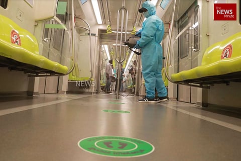 Kochi metro staff sanitising train