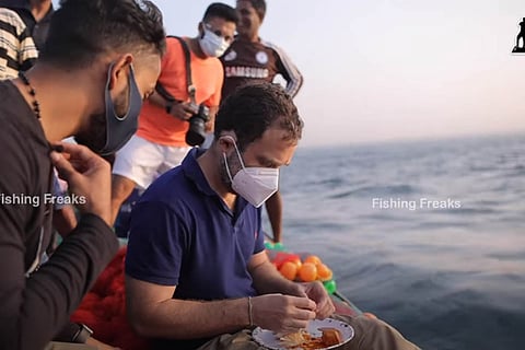 Rahul Gandhi sitting on a boat in sea and eating breakfast