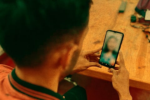 Representative image of a man video calling a woman