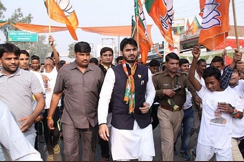 Shrikant Tyagi walking with BJP supporters