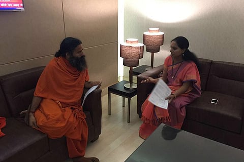TRS MP Kavitha meets Ramdev, seeks support for setting up turmeric board in India
