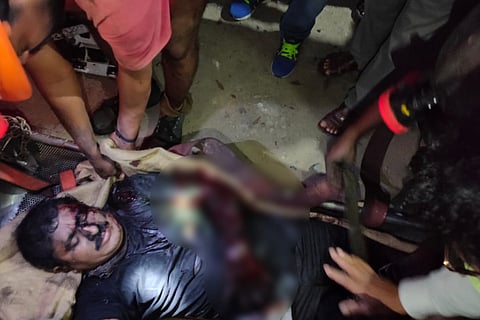 The injured worker being taken to hospital