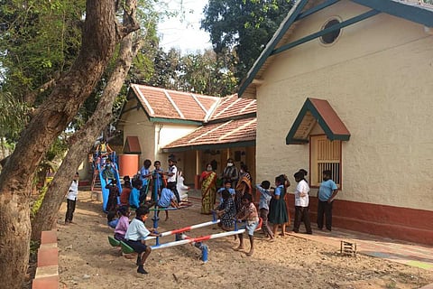 Children playing on a see-saw in a government school in Andhra Pradesh