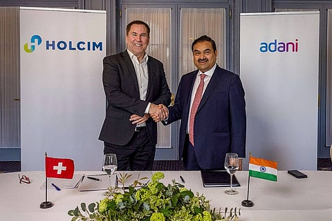 Gautam Adani signing the agreement with Holcim Ltd