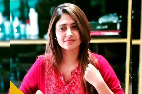 Lakshadweep film maker Aisha Sultana, booked on sedition, wearing a pink top smiling