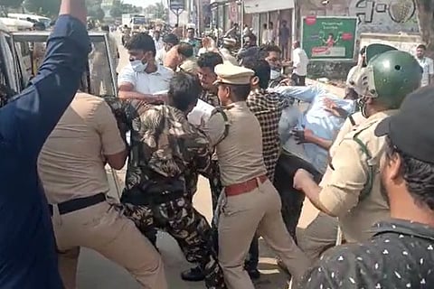 Andhra police arresting TDP supporters while protesting