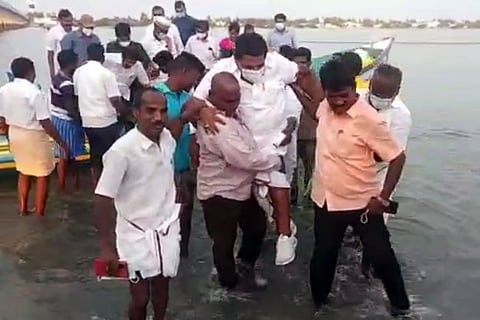 TN Minister Anitha R Radhakrishnan carried by fishermen to the shore
