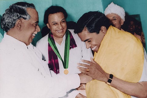 CN Annadurai (extreme left) greeting RM Veerappan as MGR looks on smiling