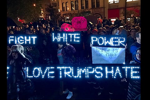 Day after elections, divided America wakes up to protests, violence