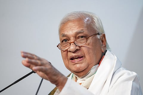 Kerala Governor Arif Mohammed Khan speaking into a mic
