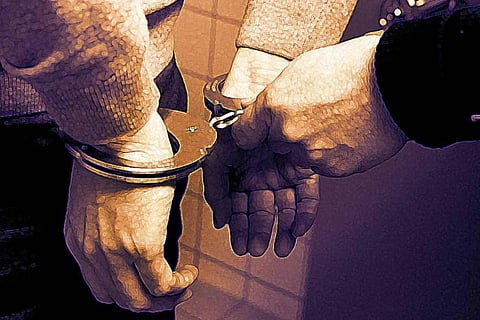 Representative image of a man being handcuffed by the police
