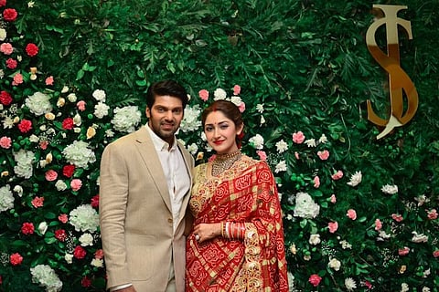 In pics: Arya and Sayyeshaa look stunning in Chennai wedding reception