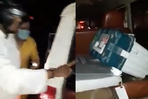 Screengrab from video showing the mob around the Assam BJP candidate's car in which the EVM was found