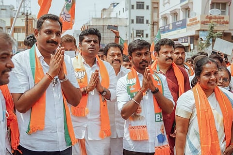 BJP leaders in Tamil Nadu wearing shawls with party symbol after victory at Urban Local Body polls