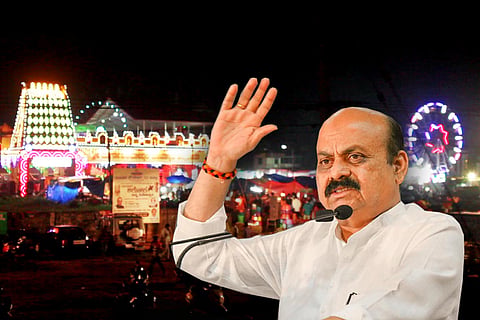 Karnataka Chief Minister Basavaraj Bommai with visuals from a temple fair in background