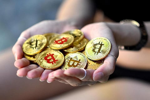 bitcoins in palms
