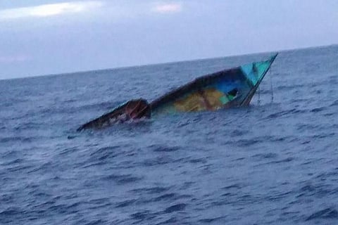 Boat sinking in sea
