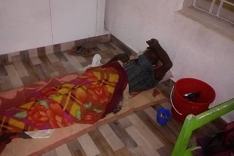 A COVID-19 patient sleeping on the floor in Kerala
