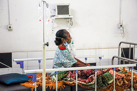 A patient in a hospital on oxygen supply
