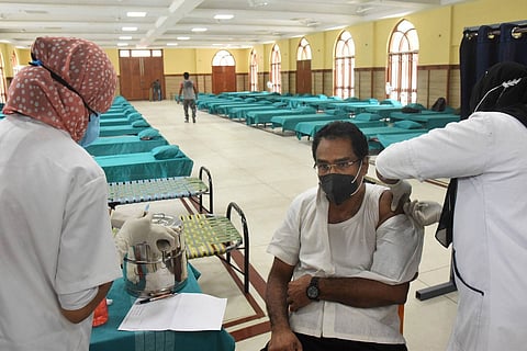 A man begin vaccinated in Kerala