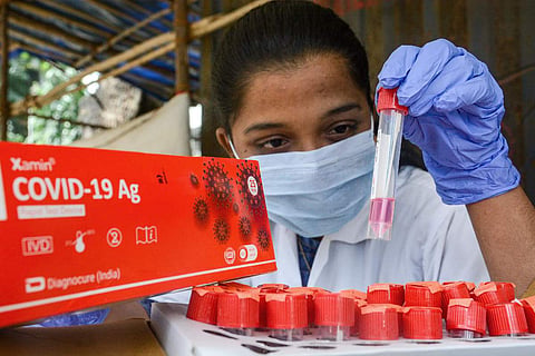 Image featuring a health worker conducting COVID-19 tests, used as an image for representation