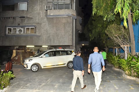 Income Tax department (IT) officials leave after conducting a raid at premises of the think-tank Centre for Policy Research (CPR),