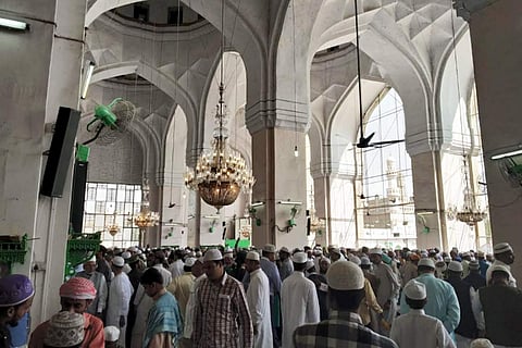 Chandeliers adorn Hyderabad’s Mecca Masjid, where worshippers gather for prayer