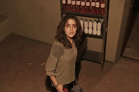 Manju Warrier looking terrified in a shot from the trailer of 'ChathurMukham'.