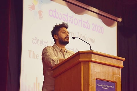 Actor Chetan Kumar speaking at an earlier event