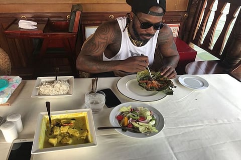 From eating Karimeen to doing Yoga, Chris Gayle enjoys holiday in Kerala