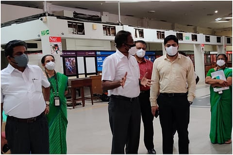 Team of Cochin International airport officials discussing about terminal conversion